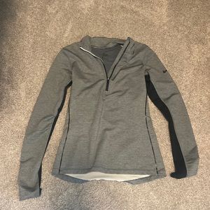 Nike women’s quarter zip. Gray. Black on arms and black mesh back.